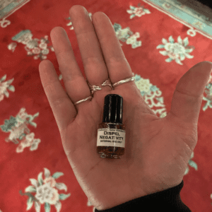A Tiny Dispel Negativity Oil Bottle