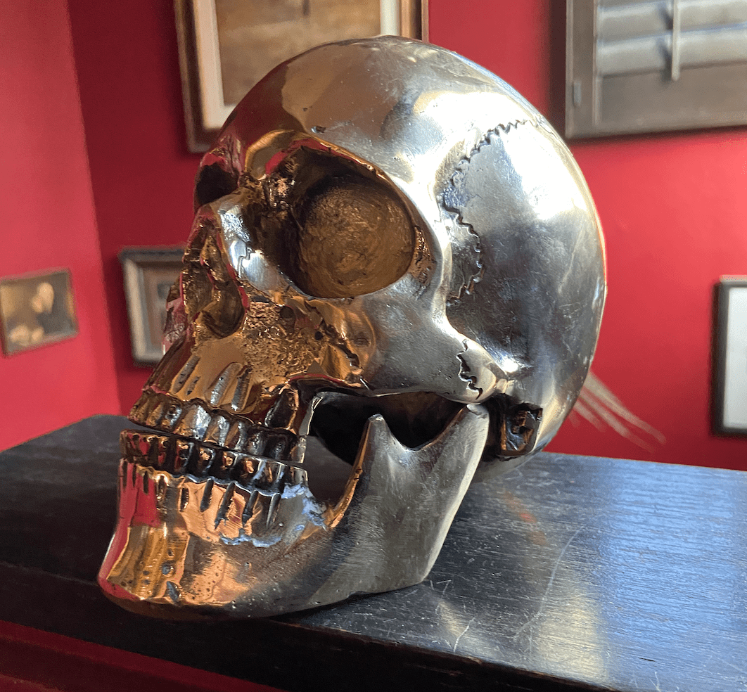 Anatomical skull with moveable jaw cast from brass